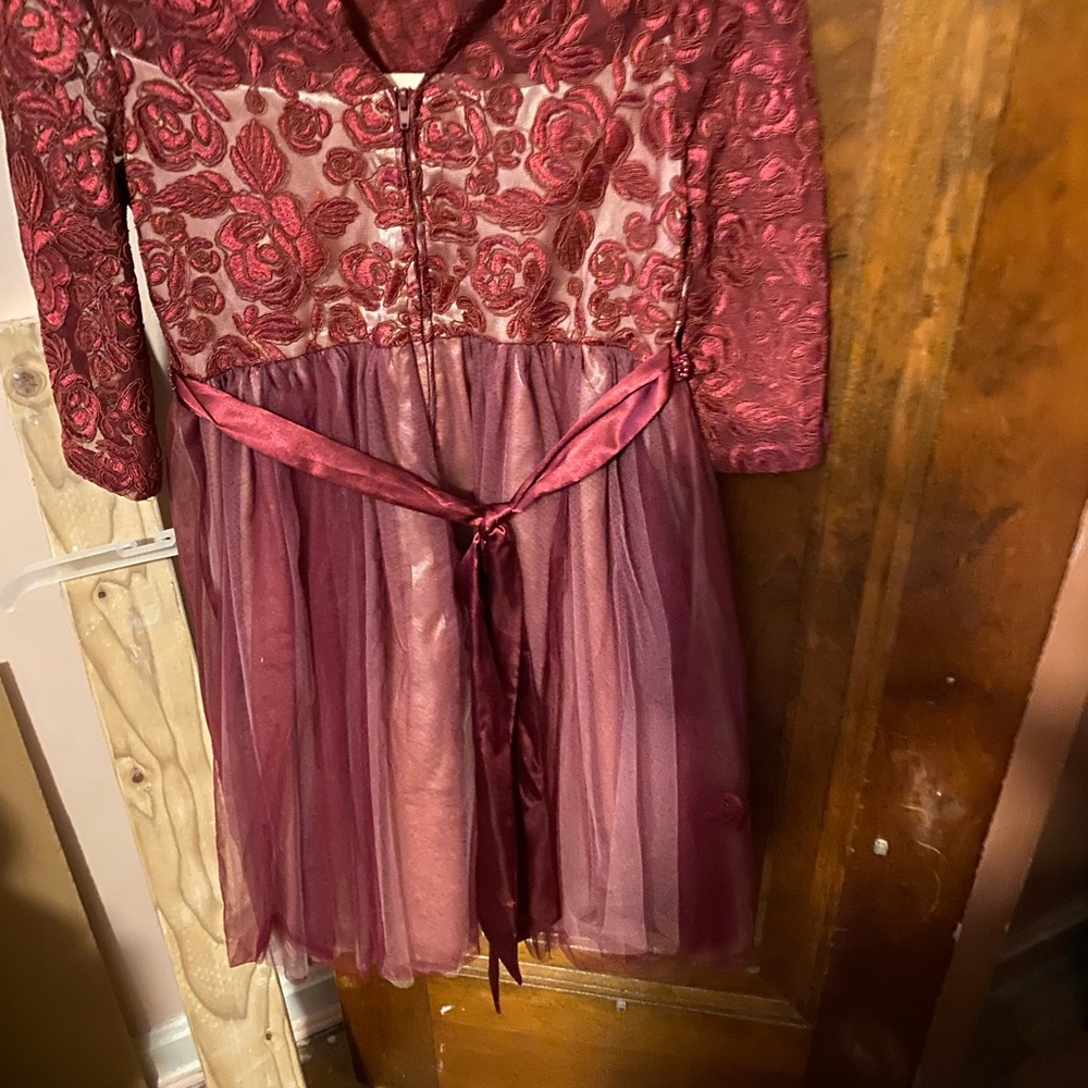 A girls formal dress bought at Macys to be in a wedding. Soft materal lined.